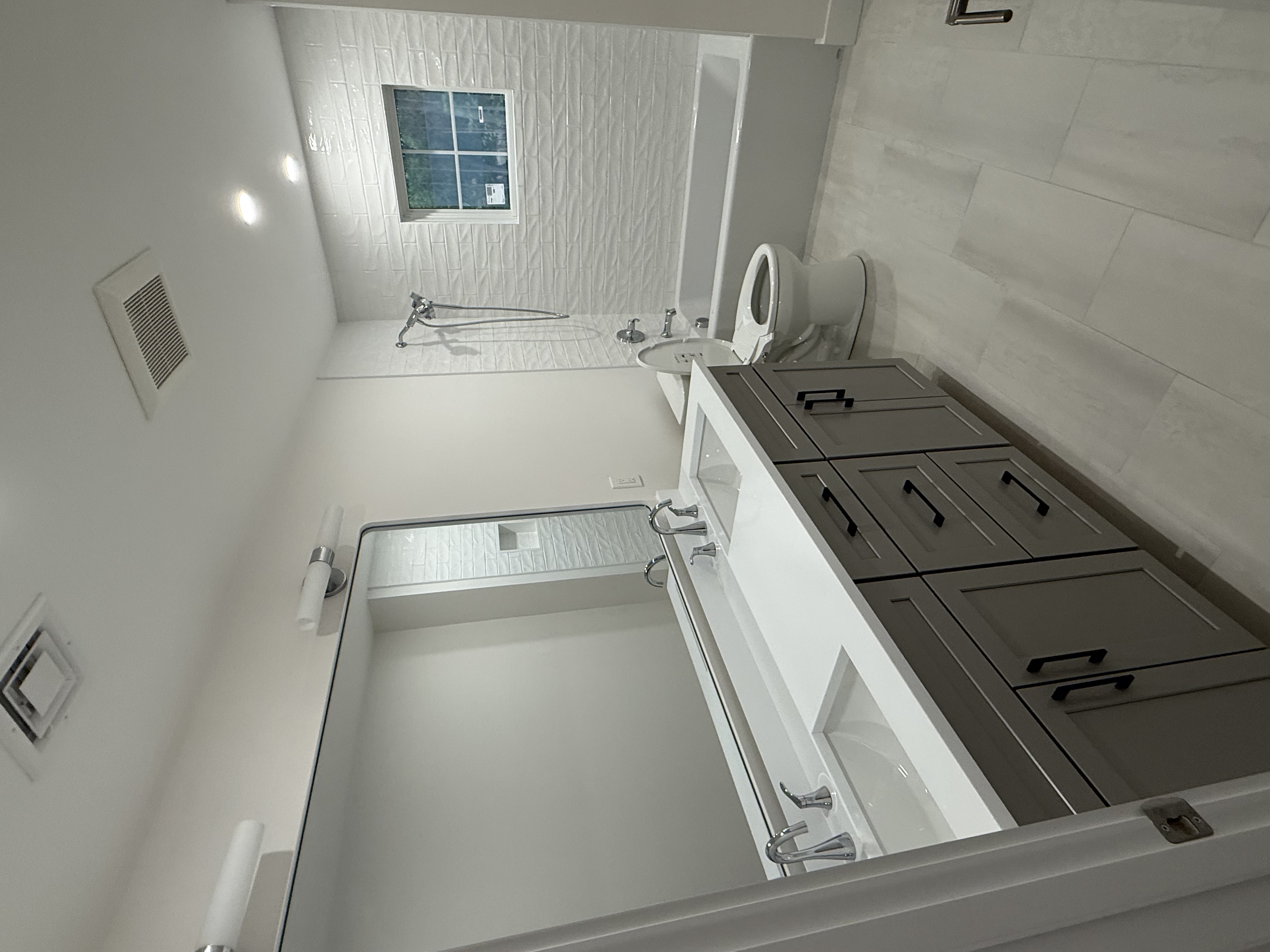 Bathroom remodel with custom tile and fixtures